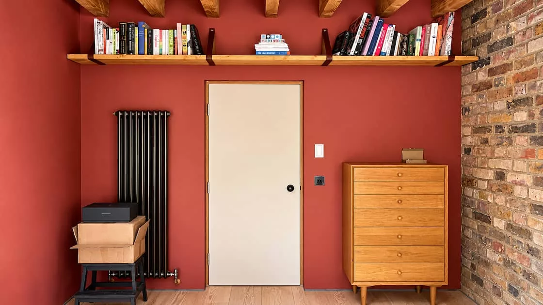 long natural wood shelf above the door