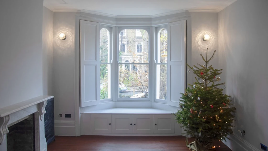 Bay window with Christmas tree.