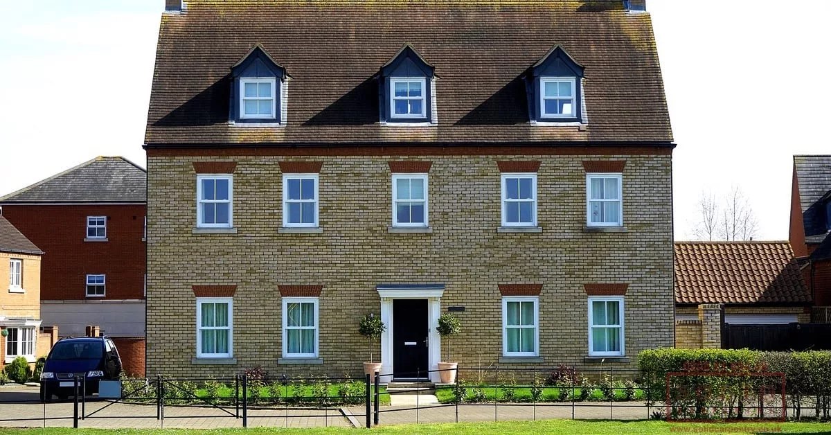 Large modern house renovation with symmetrical windows